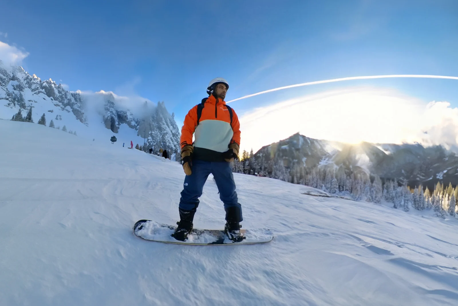 Web designer snowboarding on mountain